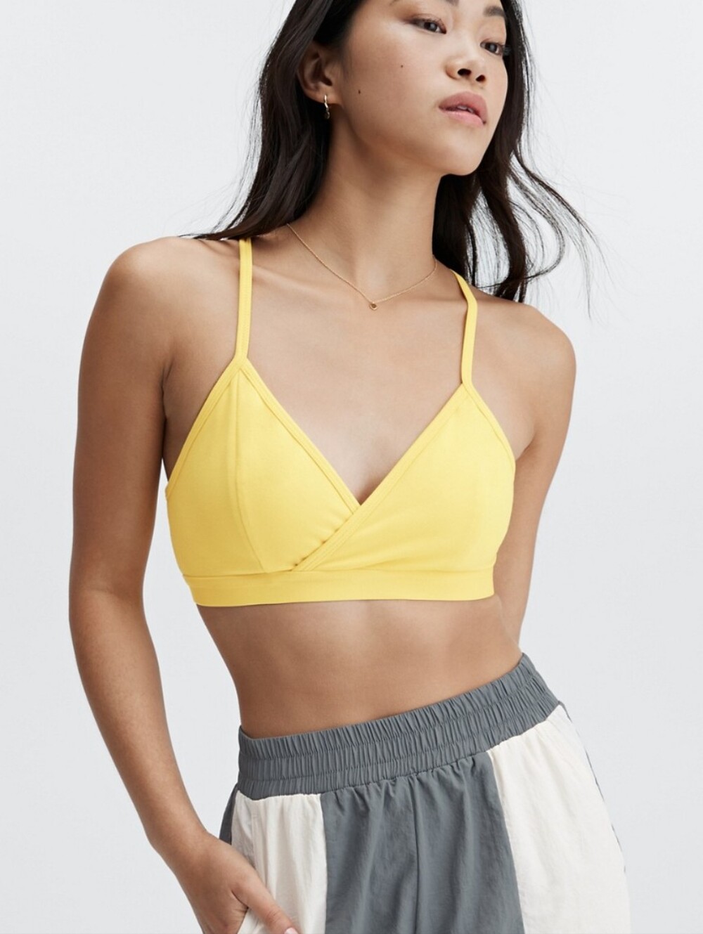Fabletics Live-In Racerback Bralette in yellow.
